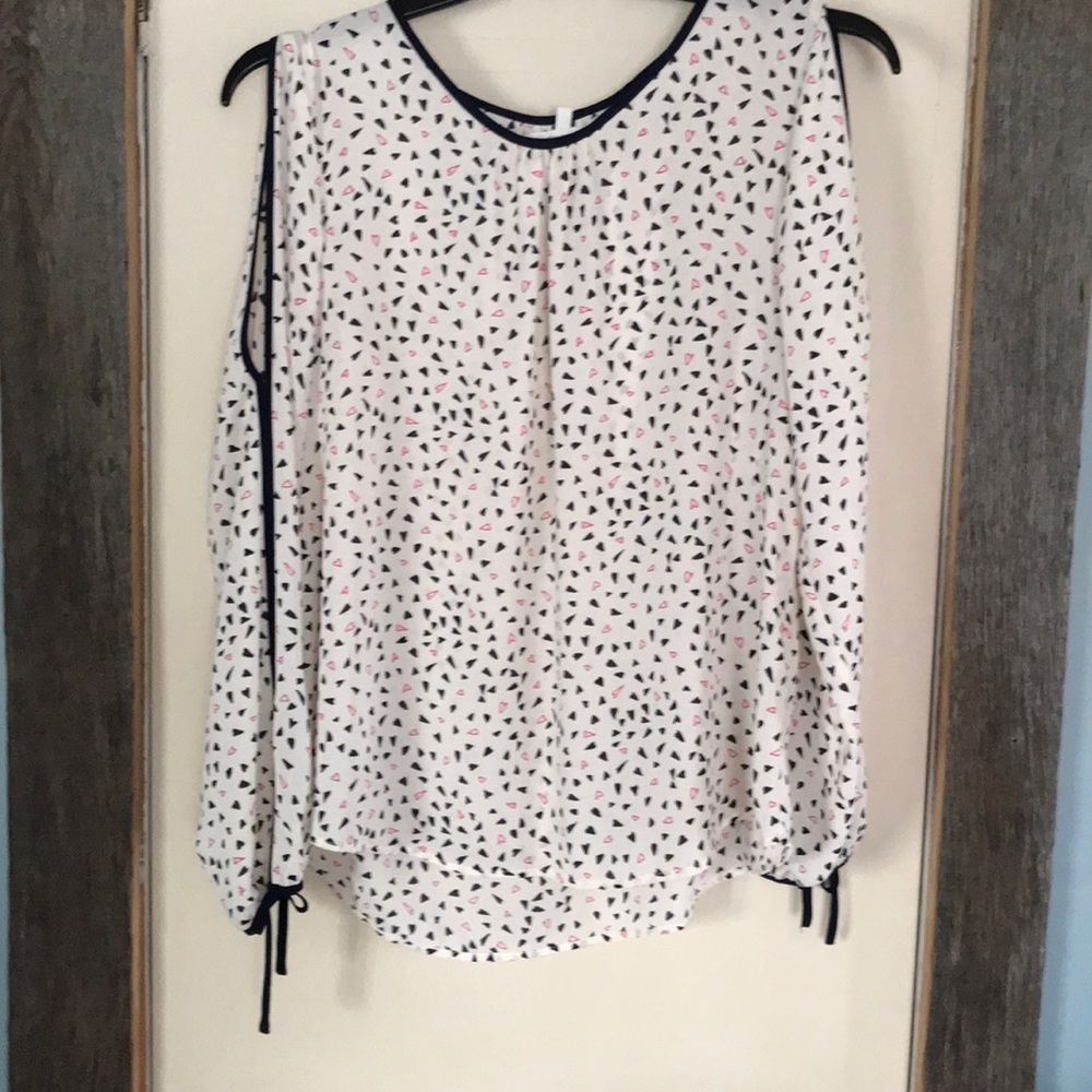 White blouse with black and red hearts